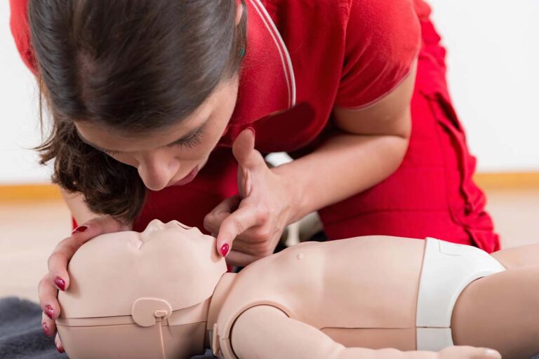 Woman learning infant CPR